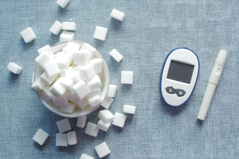 Glucometer and sugar cubes illustrating coconut sugar glycemic index research