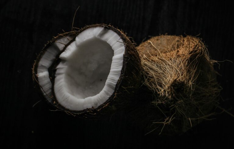 Coconut sugar crystals with a low-carb keto diet spread, illustrating whether coconut sugar fits a ketogenic diet
