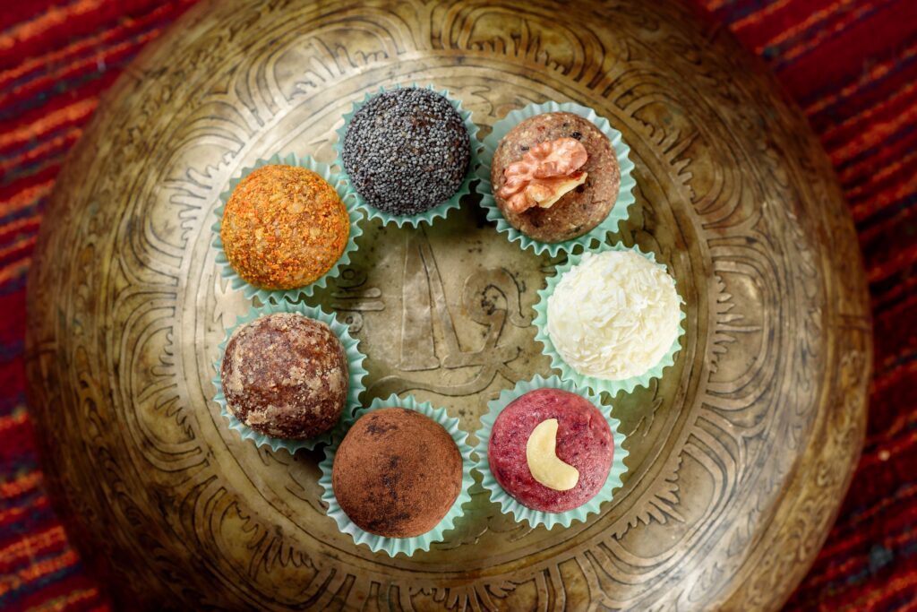 Healthy Diwali sweets made with jaggery arranged on a decorative brass plate