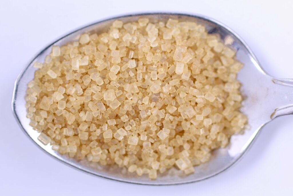 Raw coconut sugar close-up, comparing price and quality of coconut sugar brands in India