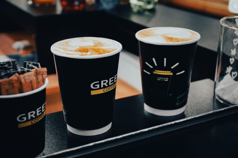 Barista adding natural sweetener to coffee at a cafe counter